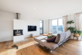 Wohnbereich mit dreiseitigen Cheminée - Rivage: Exklusive 4.5 Zimmer-Attikawohnung – Bottighofen TG